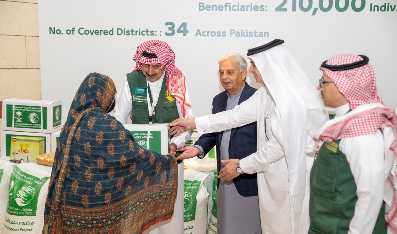 Pakistan’s Federal Minister for National Food Security Rana Tanveer Hussain and Saudi Ambassador Nawaf bin Said Al-Malki hand over food packages during the launch of the third phase of the Food Security Support project by Saudi aid agency KSrelief, at the Embassy of Saudi Arabia in Islamabad on July 4, 2025. (Photo courtesy: X/@KSAembassyPK)