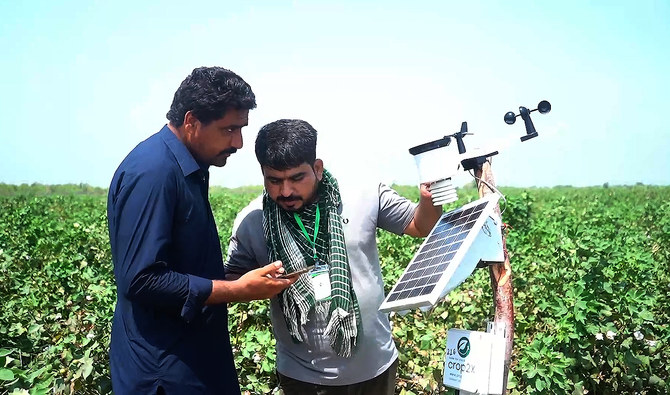 Pakistani agri-tech company Crop2X official deploys sensor probe into fields to capture soil and weather data during an interview with Arab News in Sanghar district on July 1, 2024, as the company pilot the ‘first-ever’ IoT-based climate-resilient precision agriculture project for local farmers in southern Sindh province. (AN Photo/File)