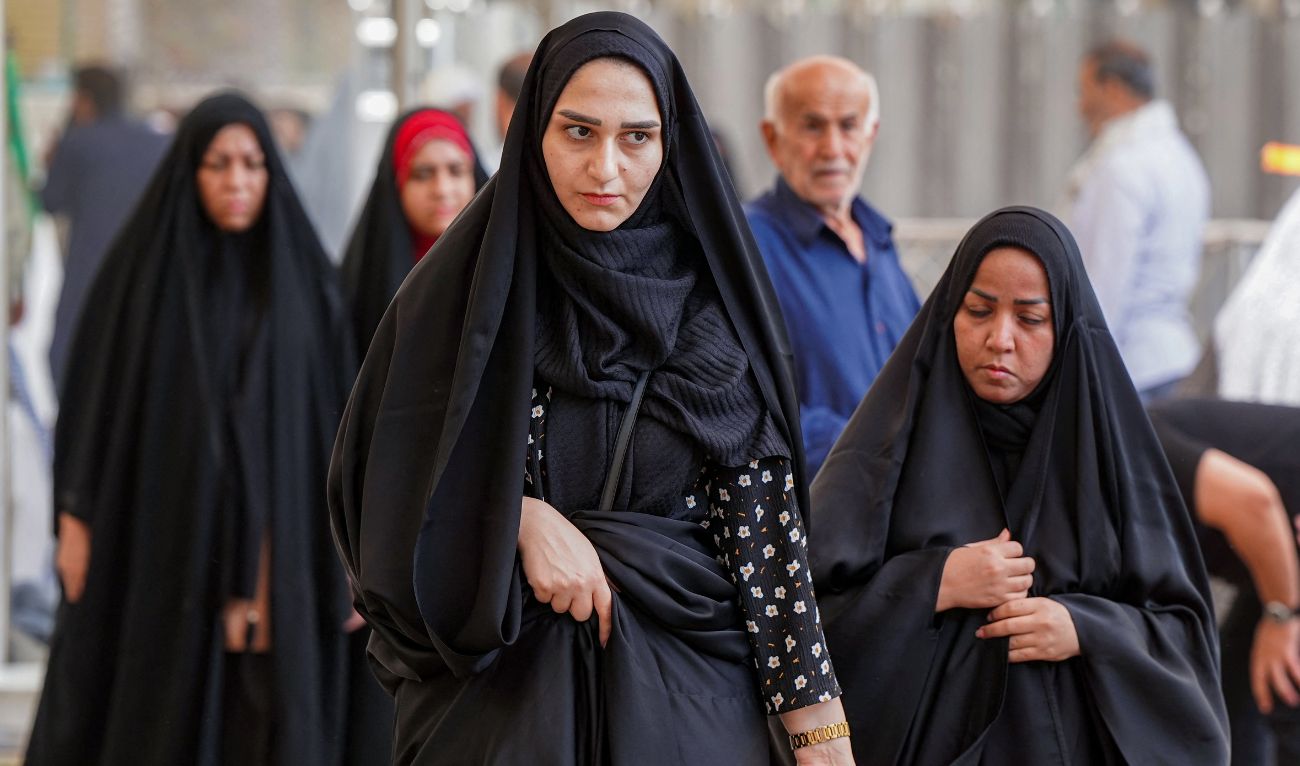 Muslim pilgrims visit the Imam Ali Shrine in Iraq's central holy shrine city of Najaf on June 13, 2025. (AFP)