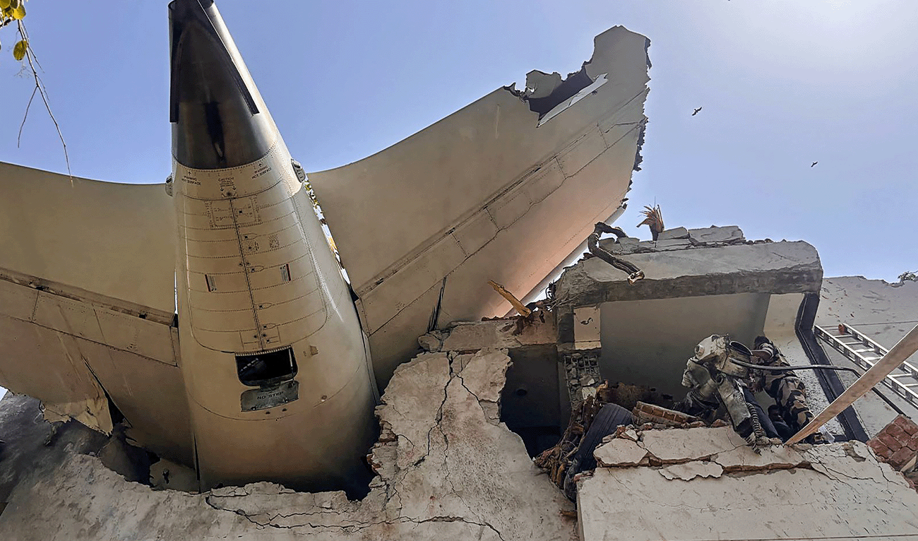 This handout photograph, taken and posted on the X (formerly Twitter) account of the Central Industrial Security Force (CISF) on June 12, 2025, shows the back of an Air India plane after it crashed in a residential area near the airport in Ahmedabad. (CISF/AFP/File)