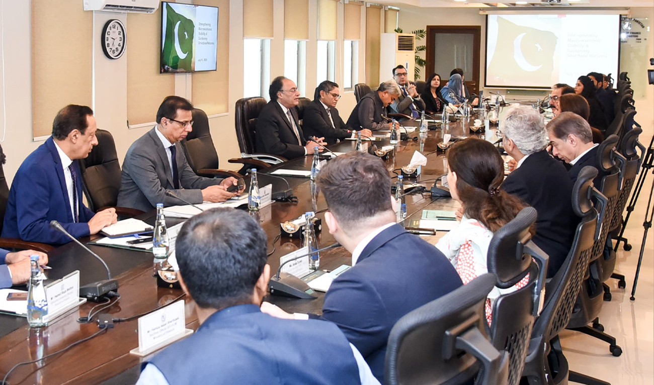 Muhammad Aurangzeb, Pakistan’s Minister of Finance and Revenue (third left), speaks during a meeting with Moody’s team in Islamabad on April 5, 2025. (AFP/File)
