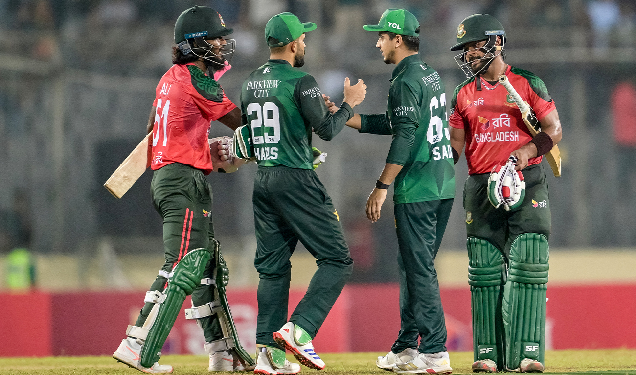 Bangladesh’s Parvez Hossain Emon (right) and Jaker Ali (left) shake hands with Pakistan’s Mohammad Haris (second left) and Saim Ayub at the end of the first Twenty20 international cricket match between Bangladesh and Pakistan at the Sher-e-Bangla National Cricket Stadium in Dhaka on July 20, 2025. (AFP)