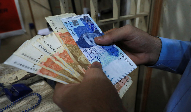 A man counts Pakistani rupee notes at a currency exchange shop in Peshawar, Pakistan, on September 12, 2023. (REUTERS/File)