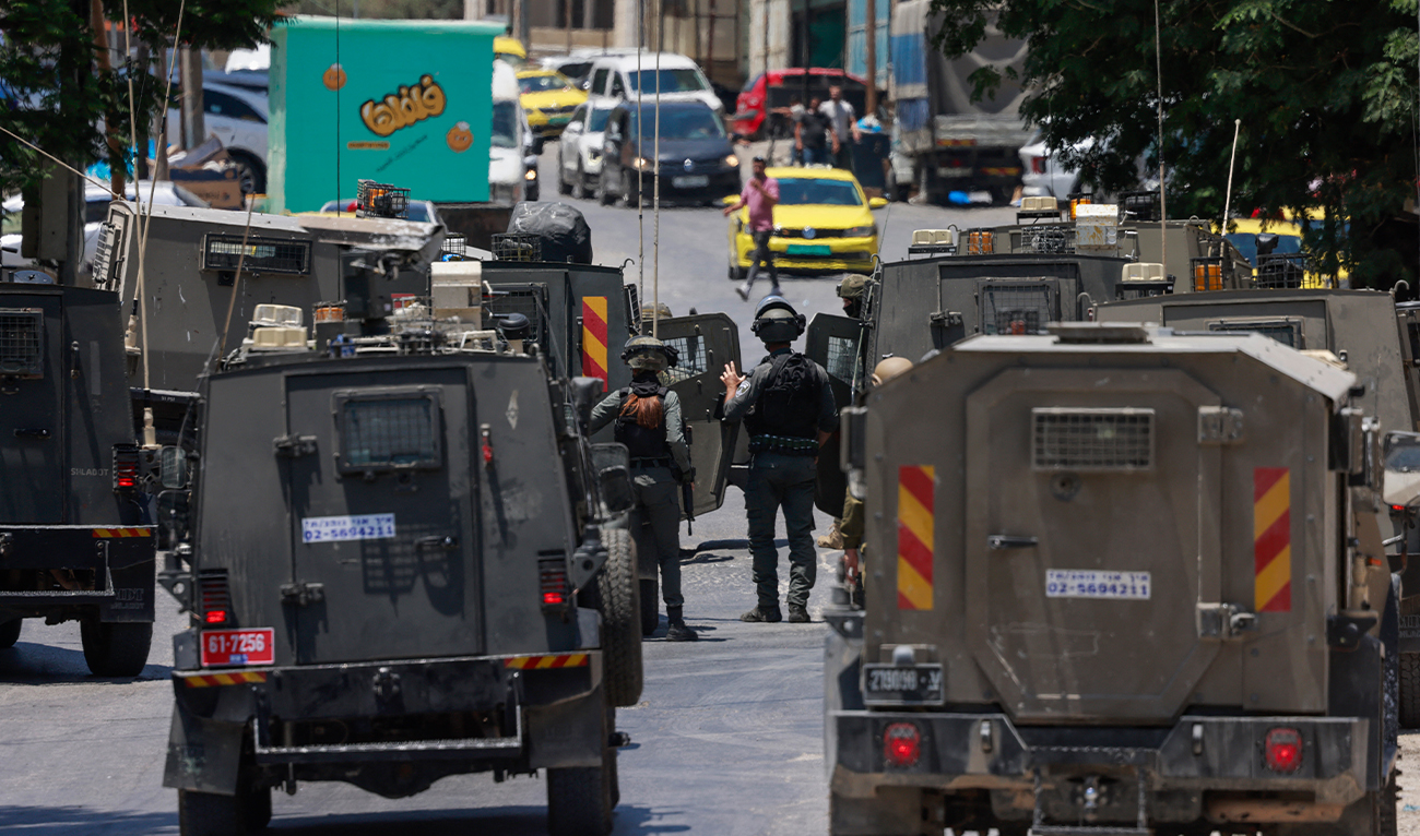 Israeli troops deploy during a raid in Nablus city in the occupied West Bank on July 23, 2025. (AFP)