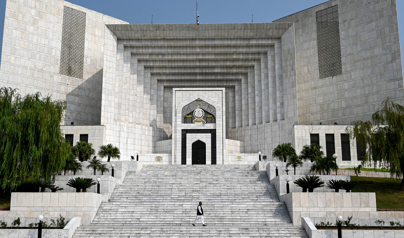 A man walks past the Pakistan’s Supreme Court building in Islamabad on October 23, 2024. (AFP/File)
