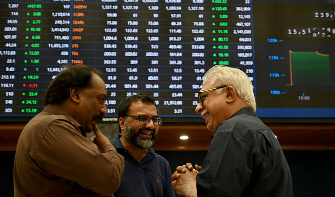 Stockbrokers interact during a trading session at Pakistan Stock Exchange (PSX) in Karachi on May 12, 2025. (AFP/File)