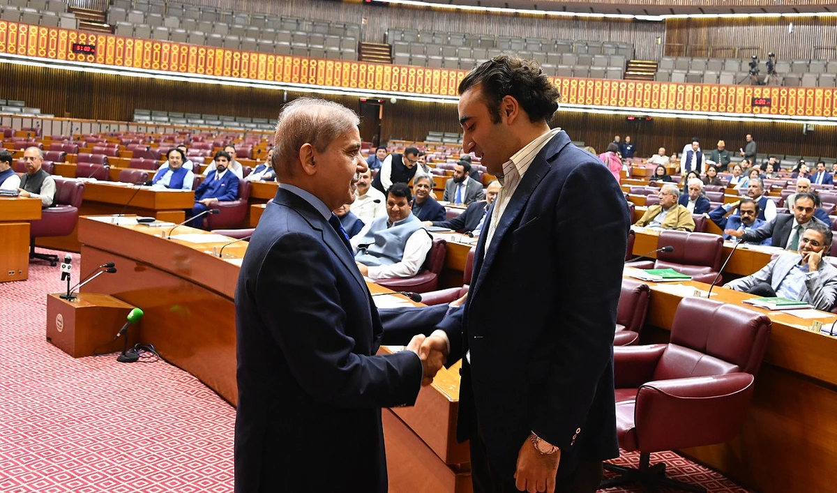 In this file photo, taken and released by Pakistan’s Press Information Department on October 21, 2024, Prime Minister Shehbaz Sharif (left) shakes hands with Bilawal Bhutto-Zardari, key coalition partner and former foreign minister, at the National Assembly in Islamabad. (PID/File)