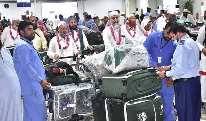Officials check baggage of Hajj pilgrims as they arrive at the Sialkot International Airport in Sialkot, Pakistan, on June 20, 2024. (APP/File)