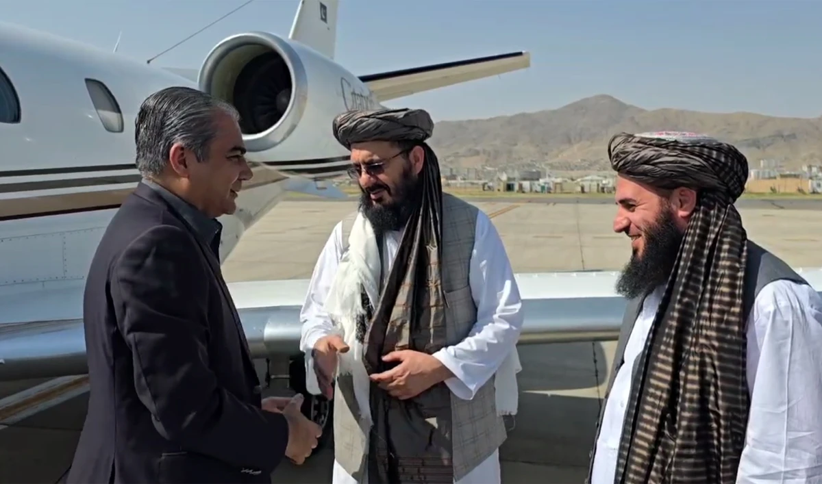 The screengrab taken from a video shows Deputy Minister of Interior Affairs of Afghanistan, Mohammad Nabi Omari, receiving Pakistan’s Interior Minister, Mohsin Naqvi, upon his arrival at Kabul airport in Kabul, Afghanistan, on July 20, 2025. (Screengrab/PTV News)