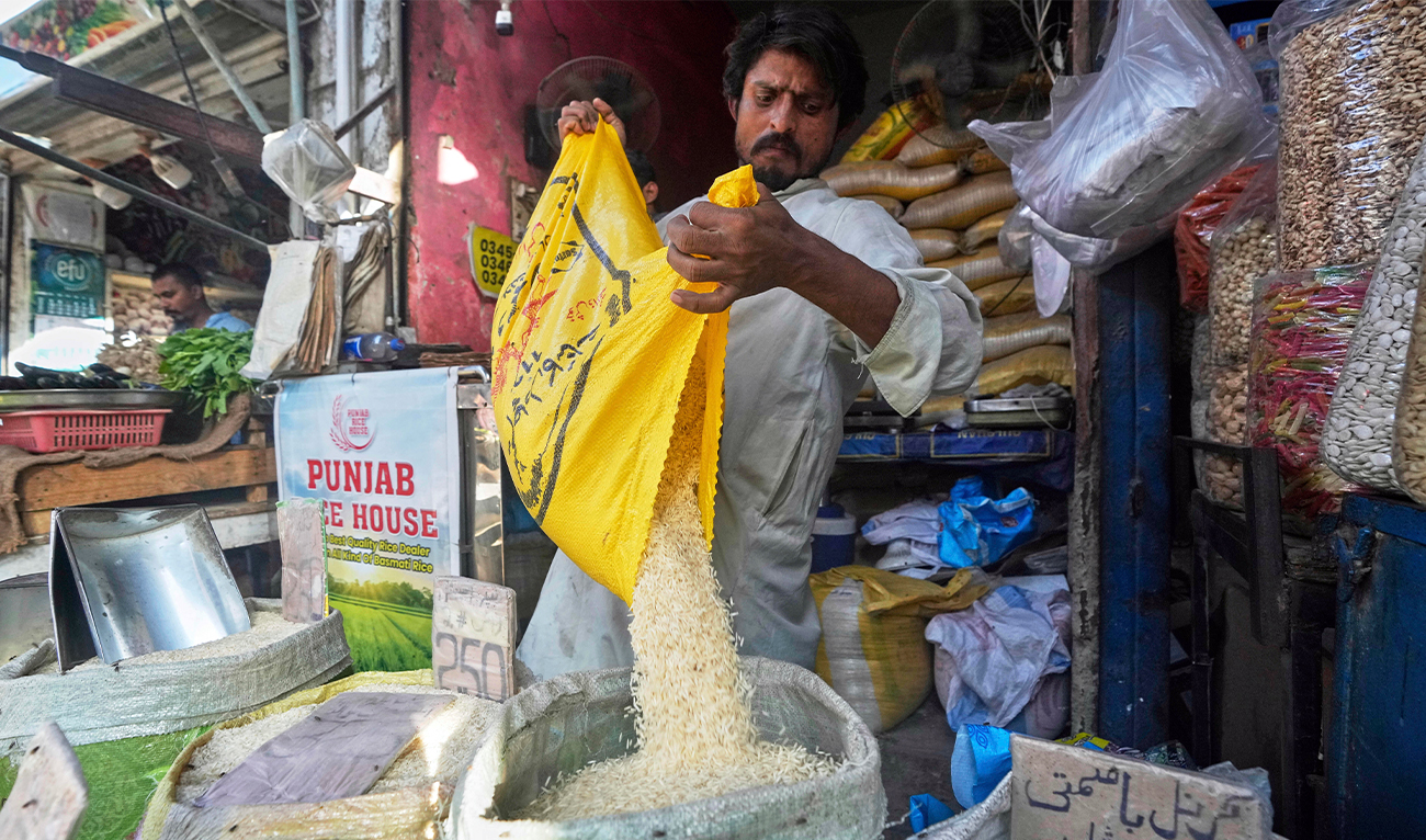 A vendor fills a sack with rice in a wholesale shop at a market in Karachi, Pakistan, on April 3, 2025. (AP/File)