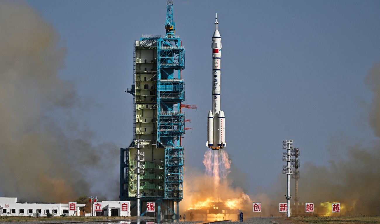 A Long March-2F carrier rocket, carrying the Shenzhou-20 spacecraft and a crew of three astronauts, lifts off from the Jiuquan Satellite Launch Centre in the Gobi desert, in northwest China on April 24, 2025. (AFP)