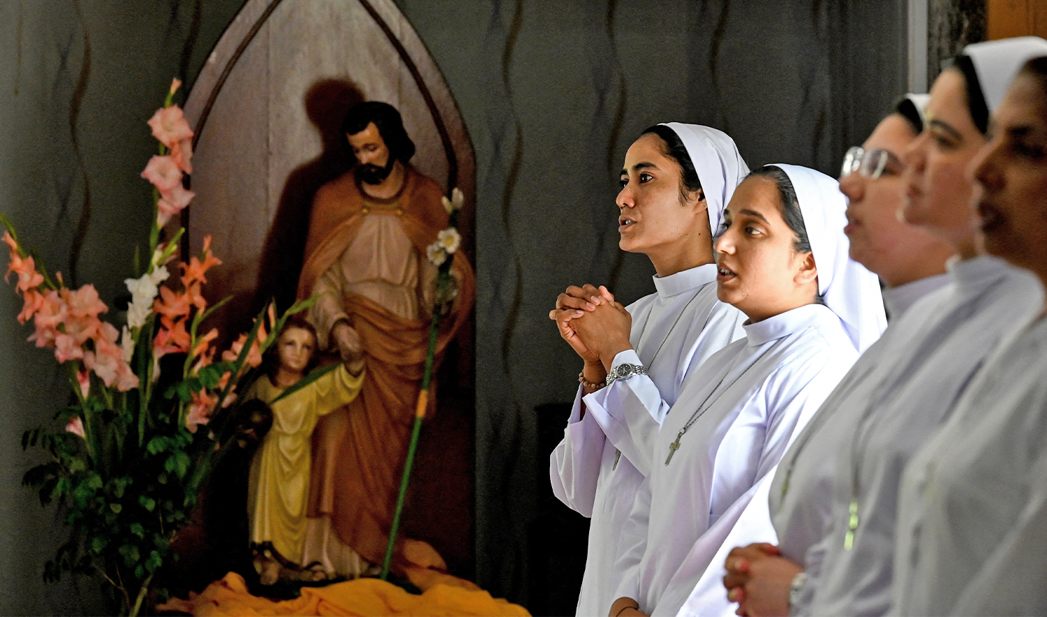 Christian nuns pray attend an Easter Sunday mass commemorating the resurrection of Jesus as part of the Holy Week celebrations at the Fatima Church in Islamabad on April 20, 2025. (AFP/File)