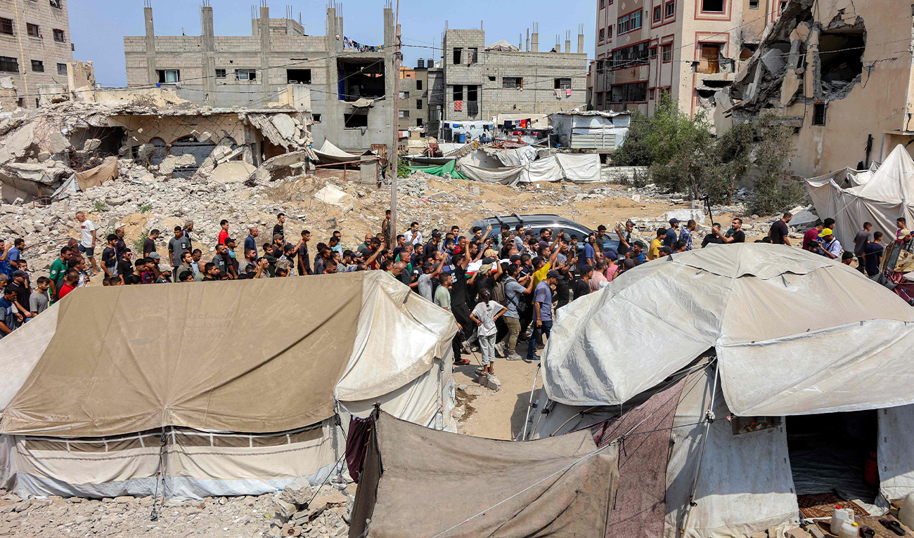 Mourners march with the bodies of the Al Jazeera journalists who were killed in an overnight Israeli strike on their tent in Gaza City, from Al-Shifa hospital to their burial at the Sheikh Radwan cemetery in Gaza City on August 11, 2025. (AFP)