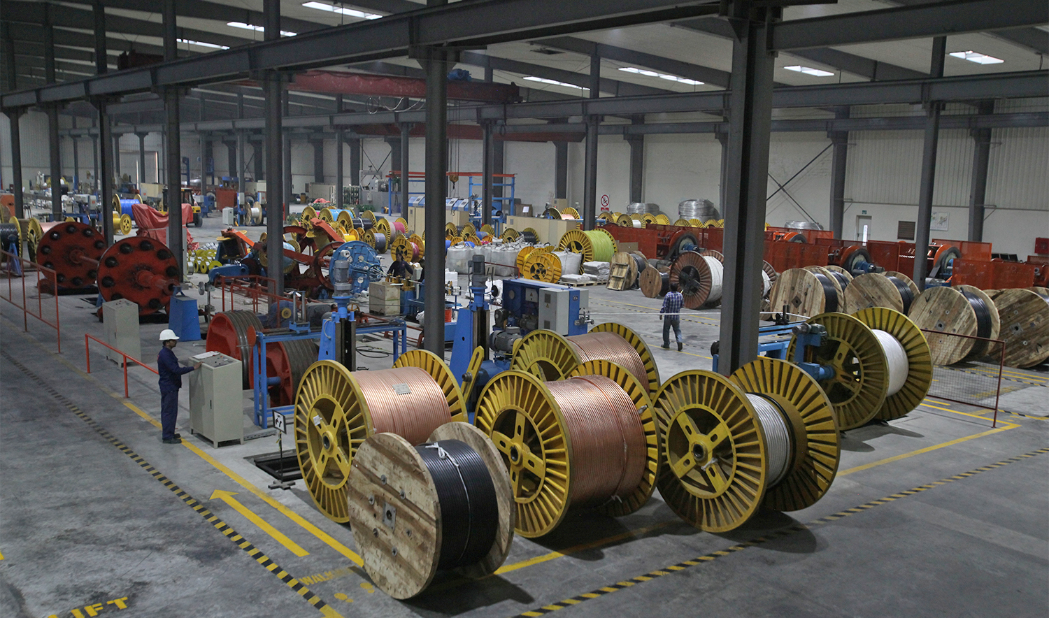 A worker monitors automatic copper wire unit at the Fast Cables plant in Lahore, Pakistan, on March 24, 2017. (REUTERS)