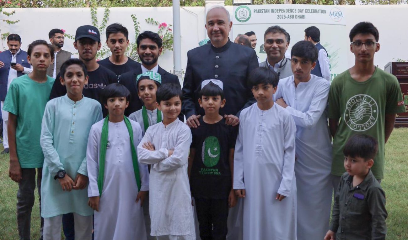 Pakistani envoy Faisal Niaz Tirmizi poses for a photo with children on Pakistan’s Independence Day celebration at the Dubai Expo City on August 14, 2025. (Embassy of Pakistan in UAE)