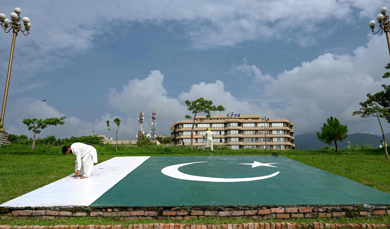 People work near the Pakistan Telecommunication Authority (PTA) headquarters building in Islamabad on August 16, 2024. (AFP/File)