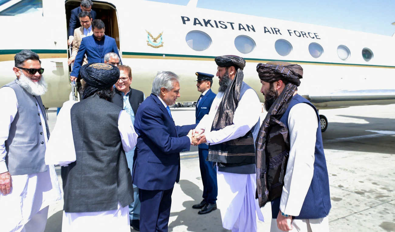 This handout photograph taken on April 19, 2025 and released by the Pakistan's Ministry of Foreign Affairs shows the country's Foreign Minister and deputy Prime Minister Ishaq Dar (4R) shaking hands with Afghan government officials upon his arrival in Kabul. (AFP/File)
