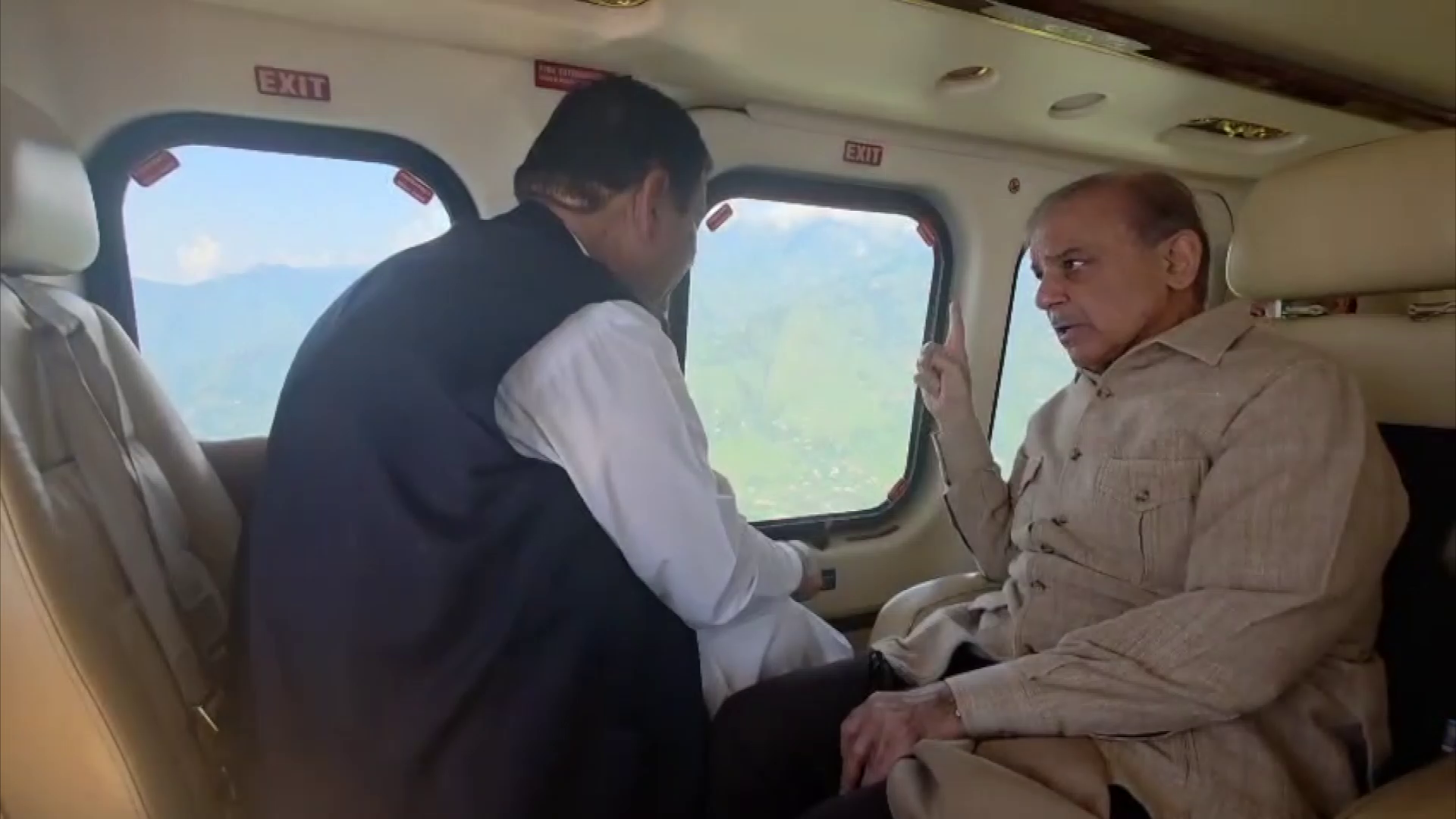 Pakistan Prime Minister Shehbaz Sharif (right) takes aerial survery of flood-hit Buner on August 20, 2025. (PM Office)