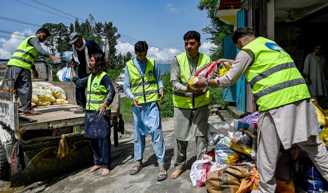 Image Caption : Volunteers prepare to convey food and essential supplies for distribution to flood victims in the Buner district of mountainous Khyber Pakhtunkhwa province on August 18, 2025. (AFP)