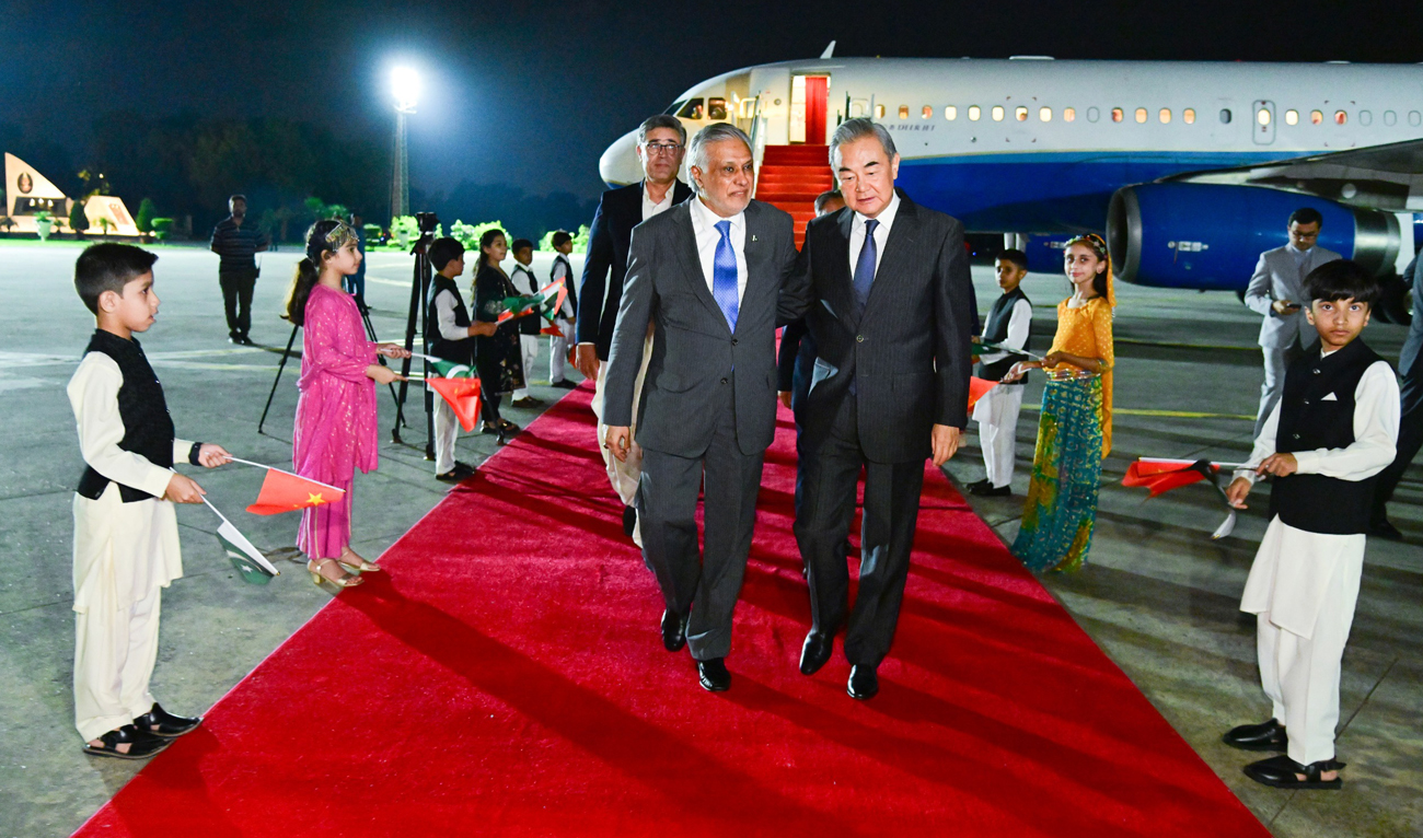 Pakistan Foreign Minister Ishaq Dar receives his Chinese counterpart Wang Yi at the Nur Khan Airbase in Rawalpindi on August 20, 2025, as China’s foreign minister arrives in Pakistan on a three-day visit. (Handout/MoFA)