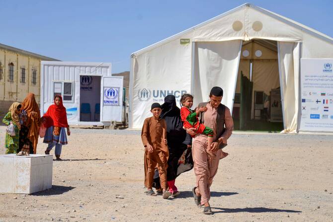 Afghans walk after their arrival from Pakistan, in Takhta Pul, Afghanistan, on June 4, 2025. (AFP)