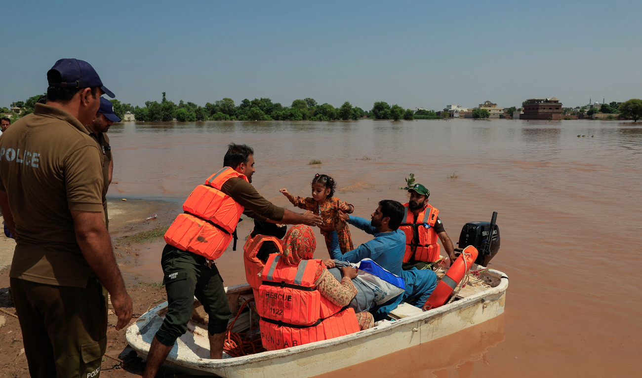 Members of Rescue 1122 evacuate residents from a flooded area following monsoon rains and rising water levels in Qadirabad village near the Chenab River in Punjab province, Pakistan on August 28, 2025. (REUTERS)