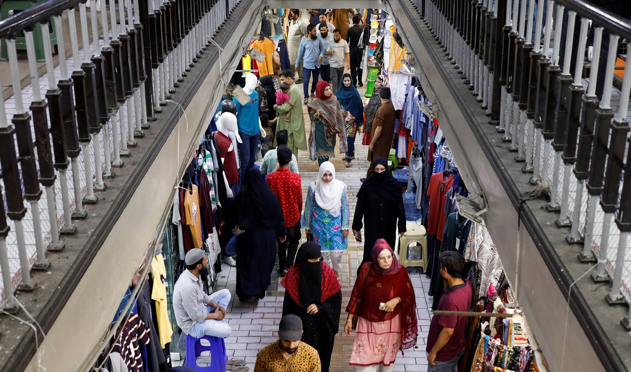 People walk as they shop in a market in Karachi, Pakistan on April 19, 2023. (REUTERS/File)