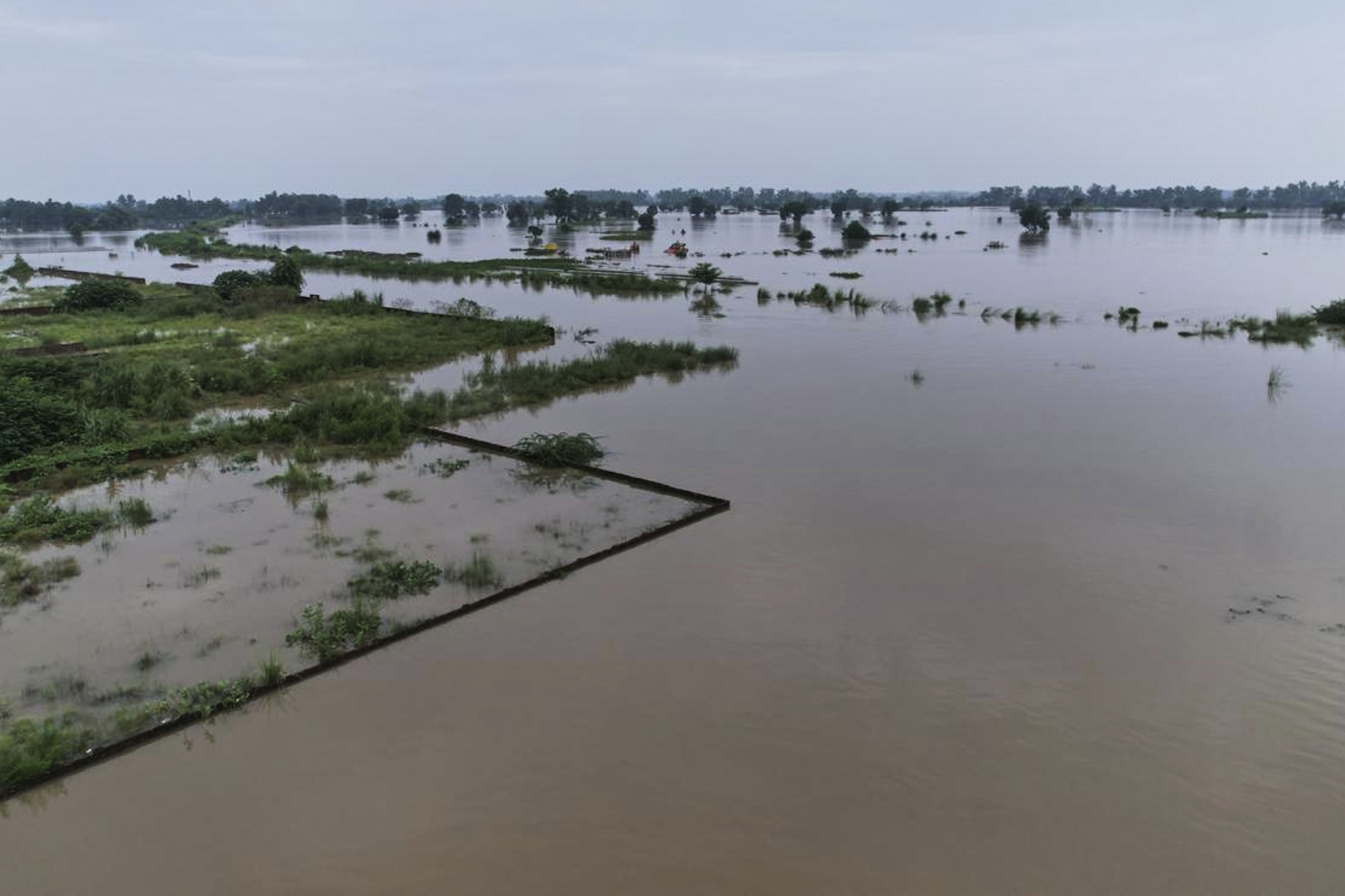 An area surrounded by floodwater is seen after torrential rains on the outskirts of Narowal, Pakistan, on August 27, 2025. (AP)