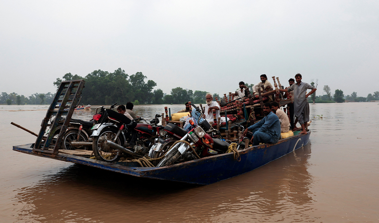 Residents travel with their belongings on a boat as they head toward higher ground, following the monsoon rains and rising water level of the Sutlej River, in Ganda Singh Wala village near the Pakistan-India border in Kasur district of the Punjab province, Pakistan, on August 29, 2025. (Reuters)