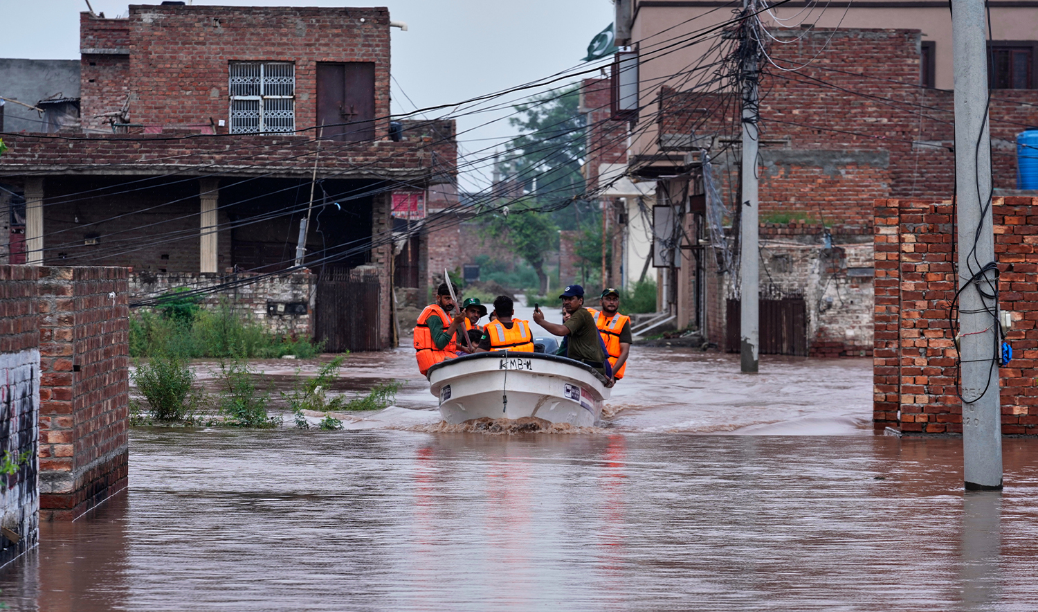 Rescue workers search for trapped people in a flooded area after torrential rains and rising water level in the Ravi river due to sudden water releases from Indian dams, on the outskirts of Lahore, Pakistan, on Aug. 29, 2025. (AP/File)