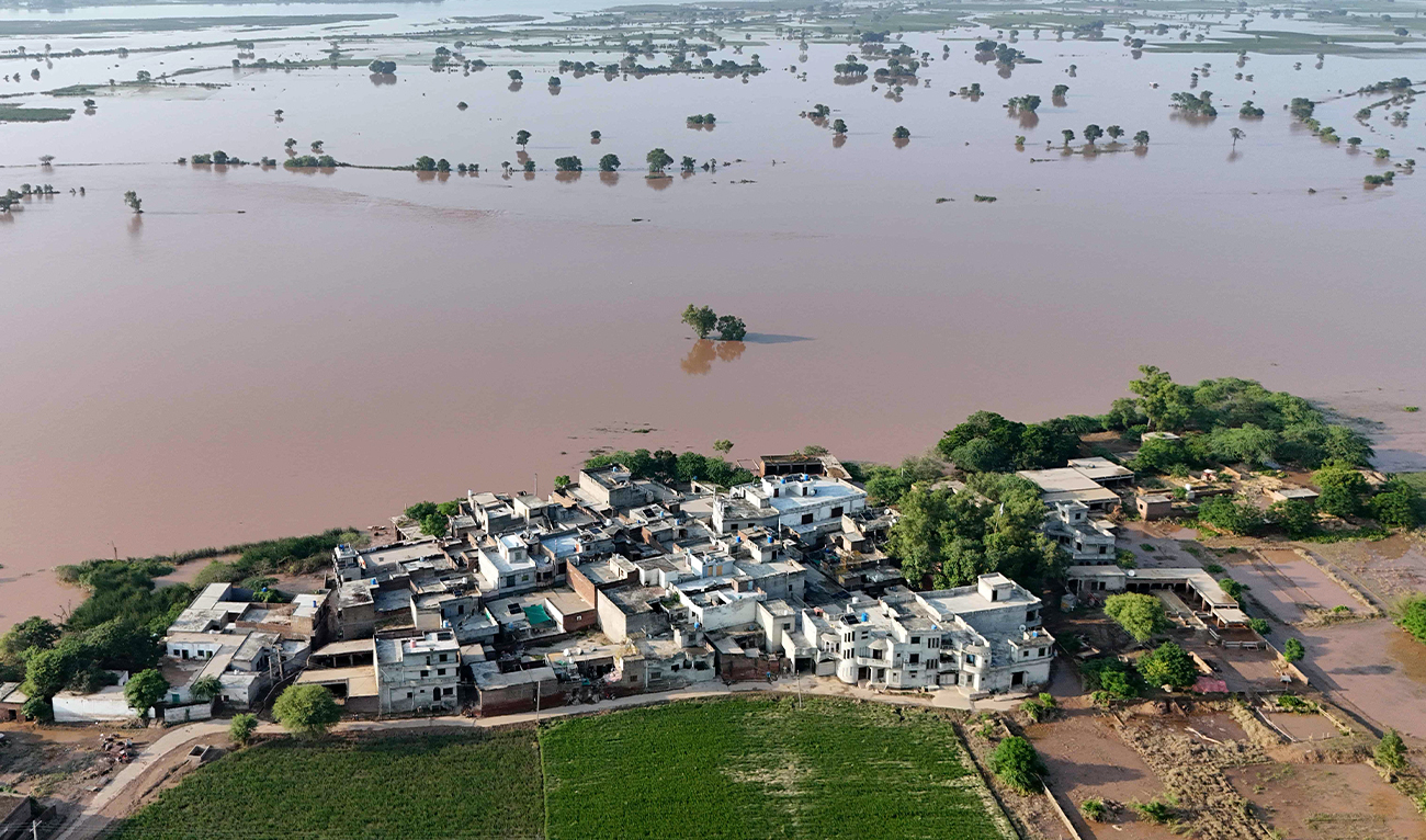 This aerial photograph shows houses submerged with floodwater at Chak Ali Sher village in Wazirabad district of Punjab province, Pakistan, on August 28, 2025. (AFP/File)