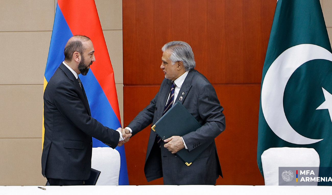 In this handout photo, released by the Ministry of Foreign Affairs of Armenia, Pakistan Foreign Minister Ishaq Dar (R) shakes hands with his Armenian counterpart, Ararat Mirzoyan, following a signing of a Joint Communiqué, on the sidelines of SCO summit in Tianjin, China on August 31, 2025. (Handout/MFA of Armenia)