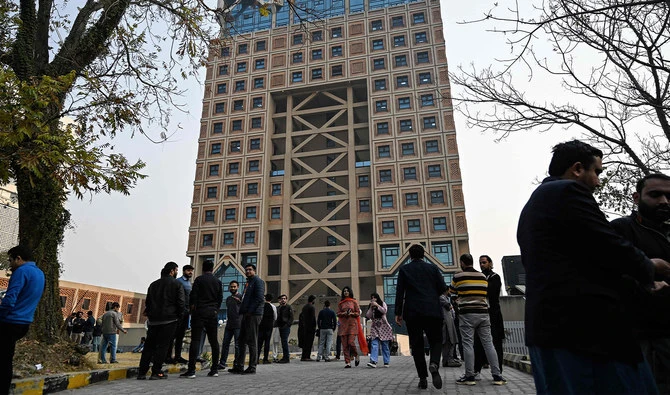 People gather outside a building in the aftermath of an earthquake in Islamabad, Pakistan, on January 11, 2024. (AFP/File)