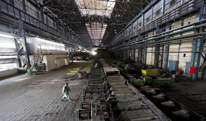 A man walks past machines at the hot strip mill department of the Pakistan Steel Mills (PSM) on the outskirts of Karachi, Pakistan, on February 8, 2016. (REUTERS/File)