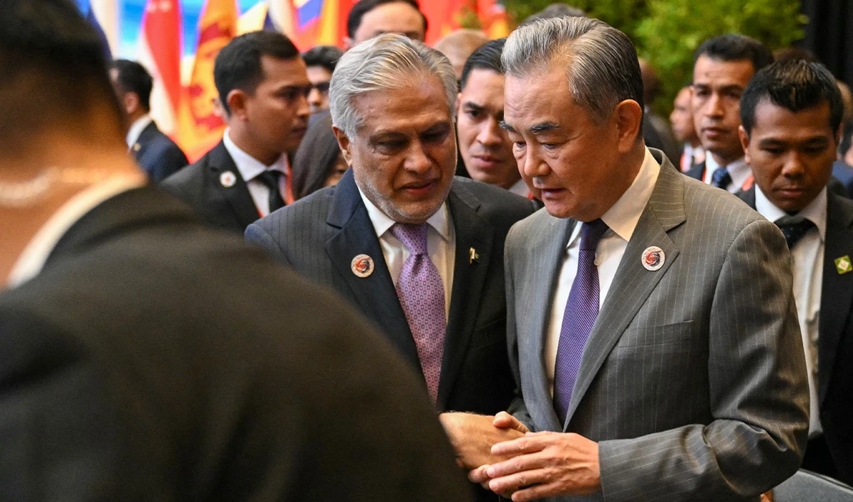 Pakistan's Deputy Prime Minister, Ishaq Dar (left) talking with China's Foreign Minister, Wang Xi at the 58th ASEAN Foreign Ministers' meeting in Kuala Lumpur, Malaysia, on July 11, 2025. (AFP/File)