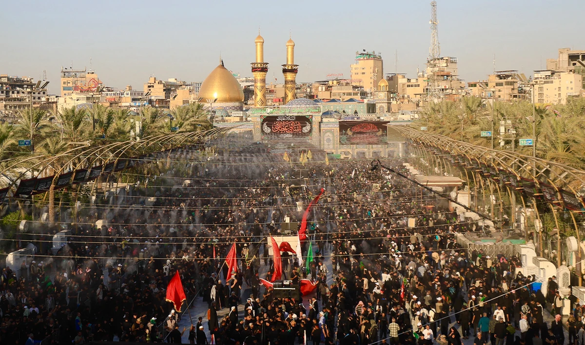 Shiite Muslim devotees attend mourning rituals next to the shrine of Imam Abu al-Fadl al-Abbas in Iraq's central holy shrine city of Karbala on August 13, 2025. (AFP)
