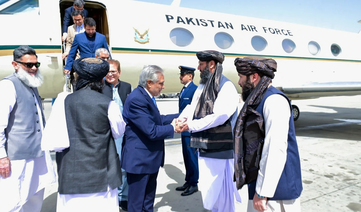 This handout photograph taken on April 19, 2025 and released by the Pakistan's Ministry of Foreign Affairs shows the country's Foreign Minister and deputy Prime Minister Ishaq Dar (4R) shaking hands with Afghan government officials upon his arrival in Kabul. (AFP/File)