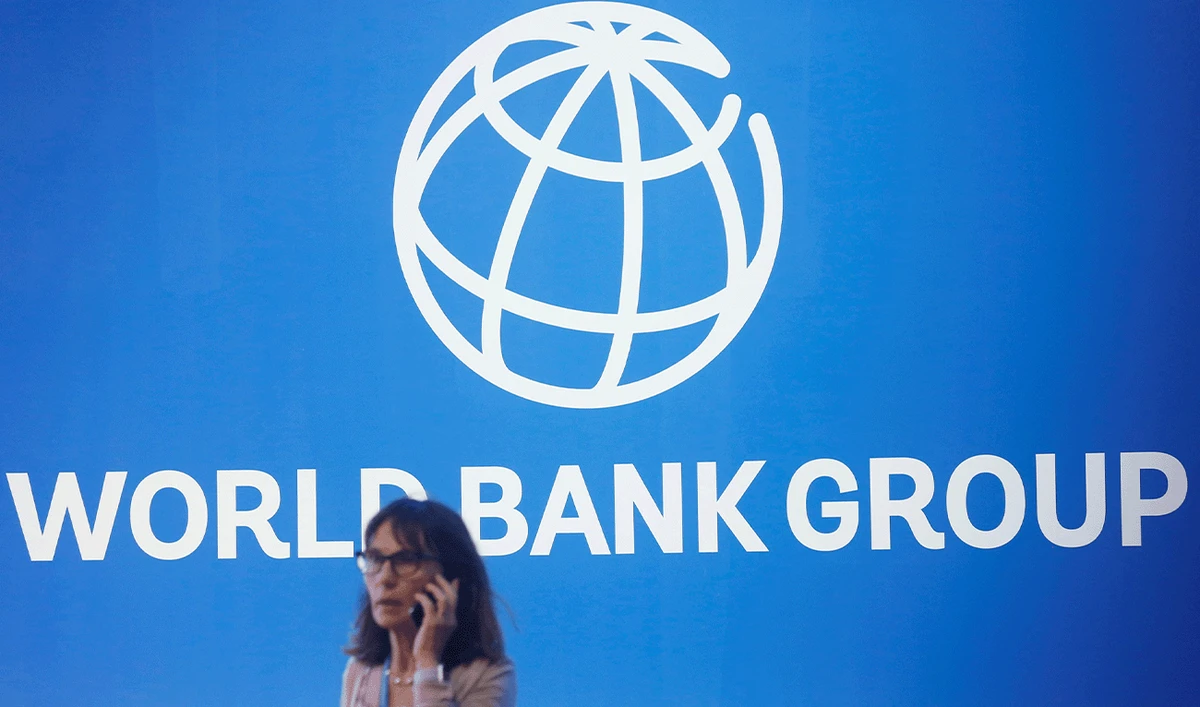 A participant stands near a logo of World Bank at the International Monetary Fund - World Bank Annual Meeting 2018 in Nusa Dua, Bali, Indonesia, October 12, 2018. (Reuters/File)