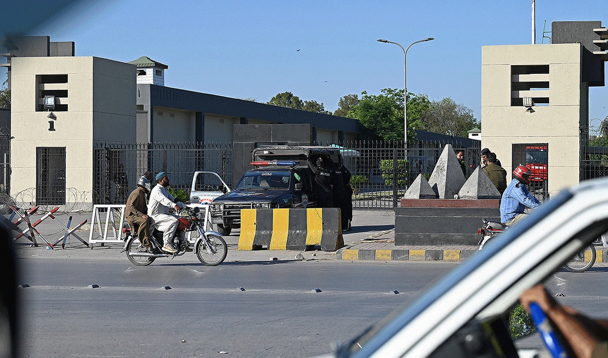 Policemen stand guard at the main entrance of Pakistan's army headquarters in Rawalpindi, Pakistan, on May 10, 2023. (AFP/File)