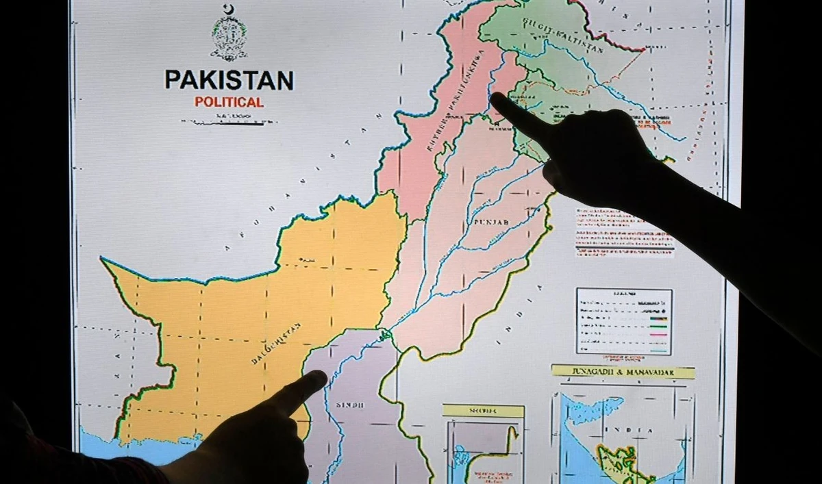 Journalists look at Pakistan's new political map on a screen at the Daily Metro Watch newspaper offices in Islamabad on August 4, 2020. (AFP/ file)
