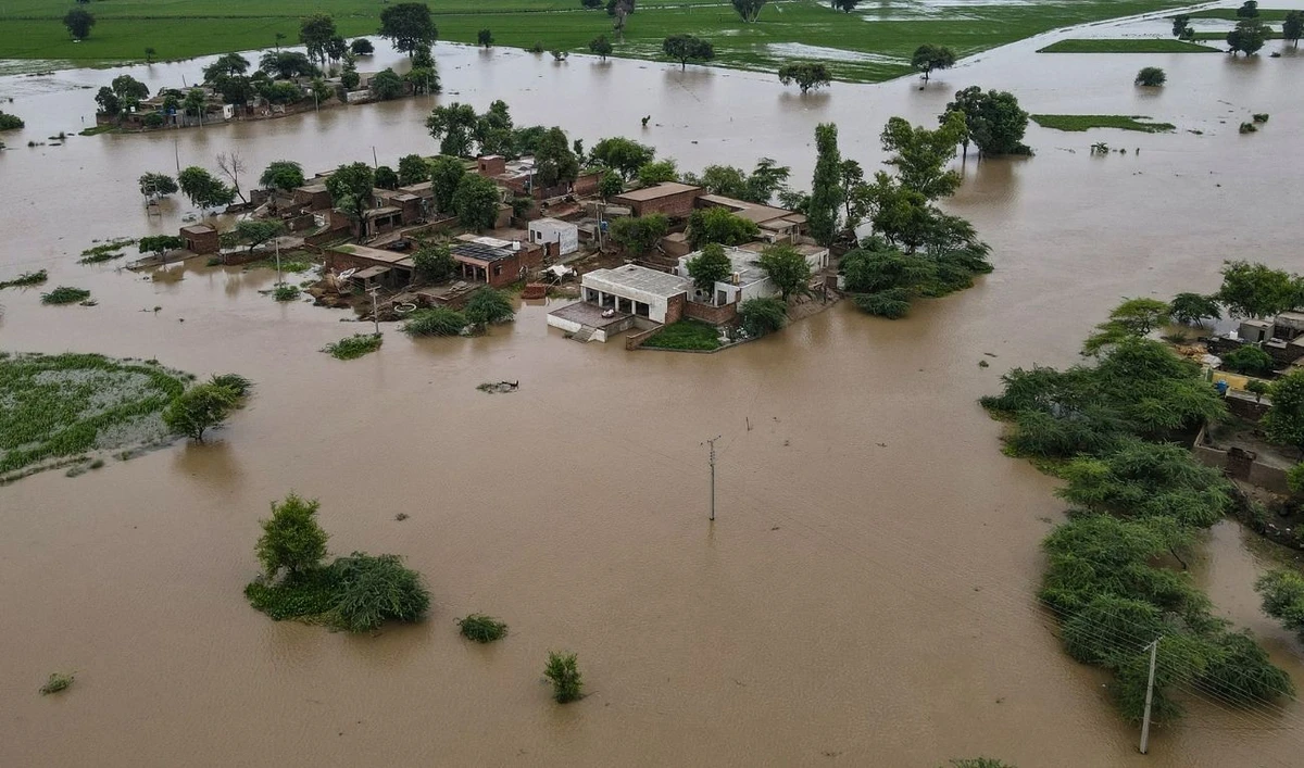 This aerial photograph shows partially submerged houses in the flood-affected area of Haqu Wala village in Pakistan's Kasur district on August 24, 2025. (AFP)