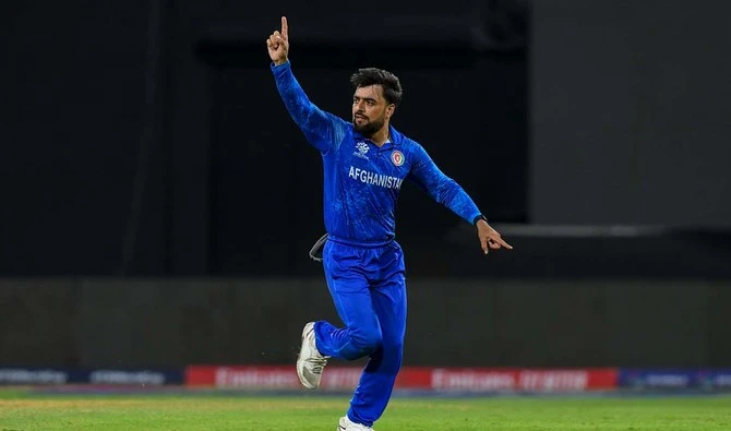 Afghanistan's captain Rashid Khan (R) celebrates the dismissal of Bangladesh's Soumya Sarkar during the ICC men's Twenty20 World Cup 2024 Super Eight cricket match between Afghanistan and Bangladesh at Arnos Vale Stadium in Arnos Vale, Saint Vincent and the Grenadines on June 24, 2024. (AFP/File)