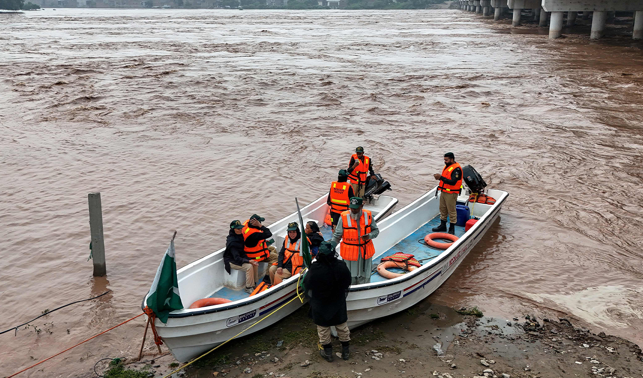 This aerial photograph shows rescue personnel preparing to patrol along the flooded Ravi river, following a rise in water levels near residential areas in Shahdara, Lahore, on August 29, 2025. (AFP/File)