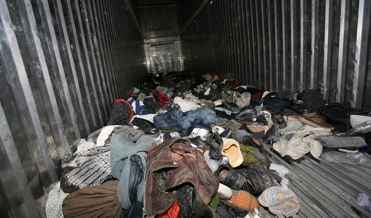 Belongings of illegal migrants are seen in a shipping container in Quetta April 4, 2009. Pakistani police found on Saturday 43 dead bodies and dozens of other people, many of them unconscious, crammed inside a shipping container on a truck from Afghanistan, an official and police said. (REUTERS)