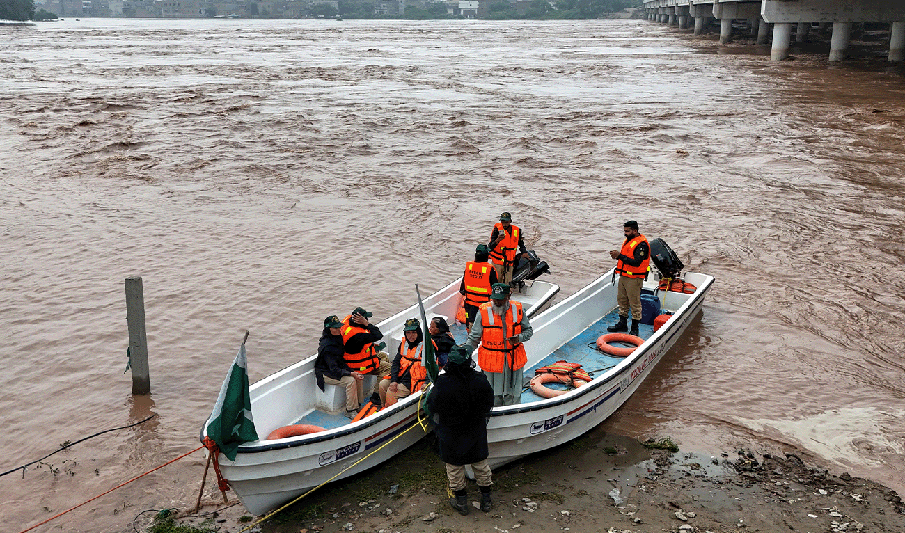 This aerial photograph shows rescue personnel preparing to patrol along the flooded Ravi river, following a rise in water levels near residential areas in Shahdara, Lahore on August 29, 2025. (AFP/File)