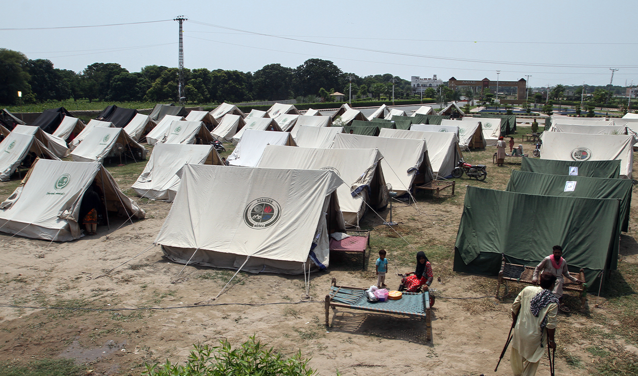 People, who fled from their homes due to flood, take shelter at a relief camp on the outskirts of Multan, Pakistan, on September 2, 2025. (AP)