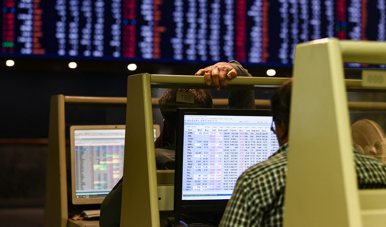 Stock brokers monitor share prices on computers during a trading session at the Pakistan Stock Exchange (PSX) in Karachi on February 12, 2024. (AFP/File)