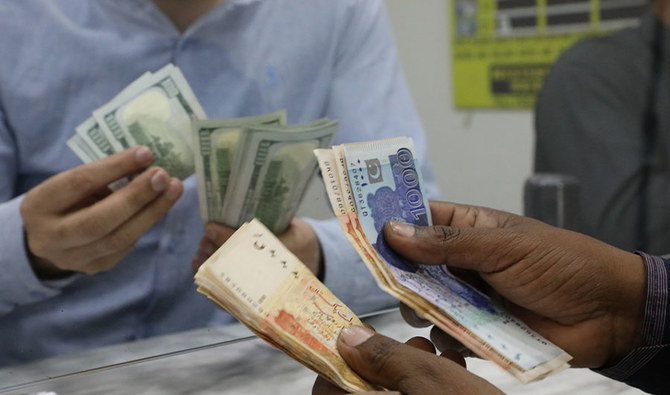 Customer at currency dealers is counting Pakistani rupees in Islamabad on Monday, April 1, 2019. (AN Photo/File)