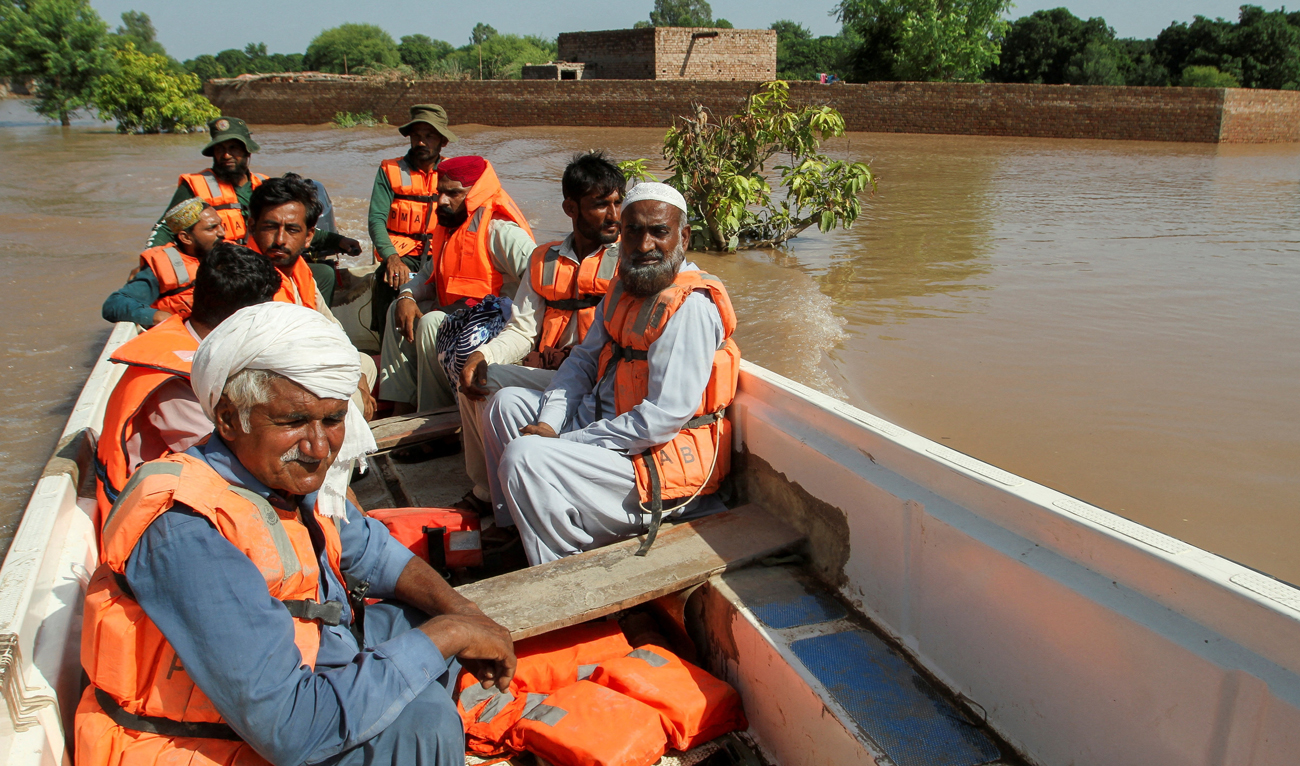 Residents sit in a Rescue 1122 boat as they evacuate from the flooded area, following monsoon rains and rising water levels of the Chenab River, in Qasim Bela village on the outskirts of Multan in Punjab province, Pakistan, on September 11, 2025. (REUTERS)