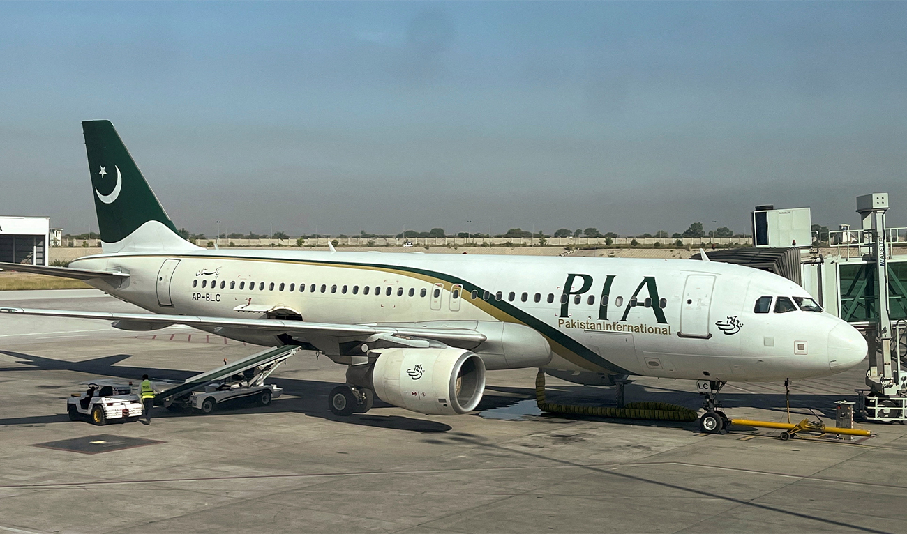 View of a Pakistan International Airlines (PIA) passenger plane, taken through a glass panel, at Islamabad International Airport, Pakistan, on October 3, 2023. (REUTERS/File)